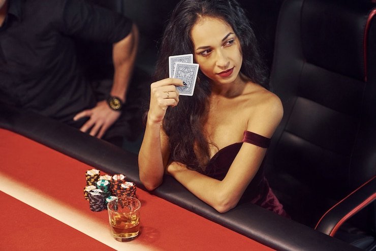 Live dealer hosting Andar Bahar with cards revealed on studio table